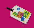 Luggage tag with colorful "I'm outta here 2026" text on a white background. Merchandised on a hot pink background.