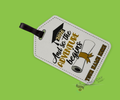 A white luggage tag with graduation design and "so the adventure begins 2026" text with a name customization option on a bright green background.