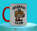 Breakfast Club vintage-inspired 11.8 oz orange-and-white two-tone ceramic mug with animated pancakes holding up two fingers.

