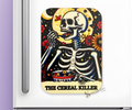 A magnet with a skeleton design eating cereal, titled 'The Cereal Killer' on a white refrigerator door background