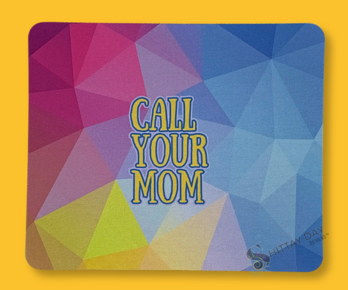 Colorful geometric mouse pad with 'Call Your Mom' text merchandised on a yellow background