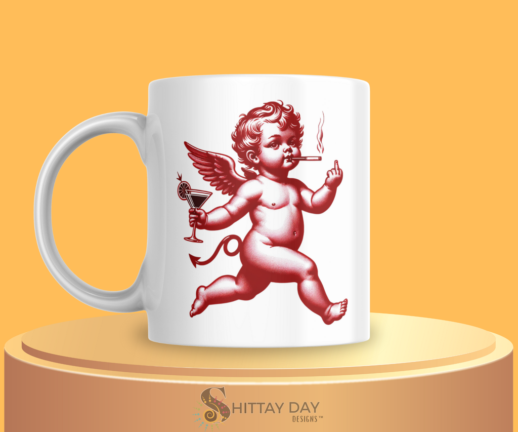 White mug with red cherub smoking a cigarette, holding a martini glass, and flashing a middle finger design merchandised on a yellow background