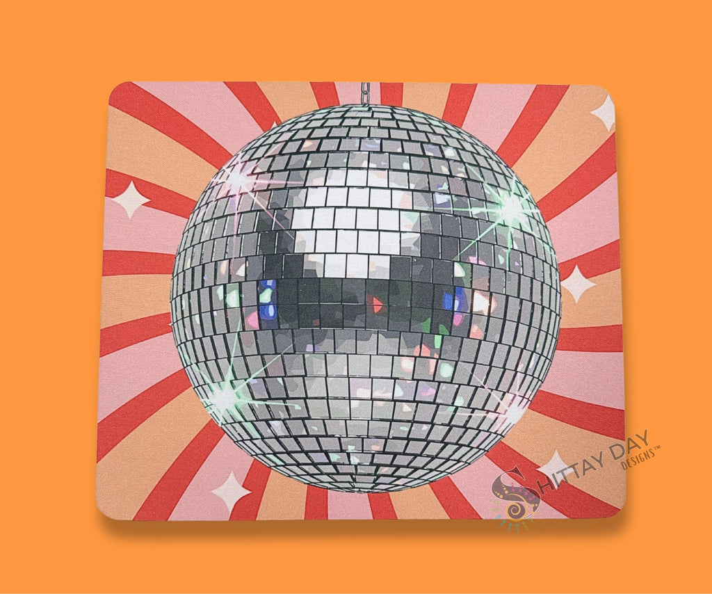 Retro disco ball mouse pad shown with a computer mouse for a bright, playful desk setup.
