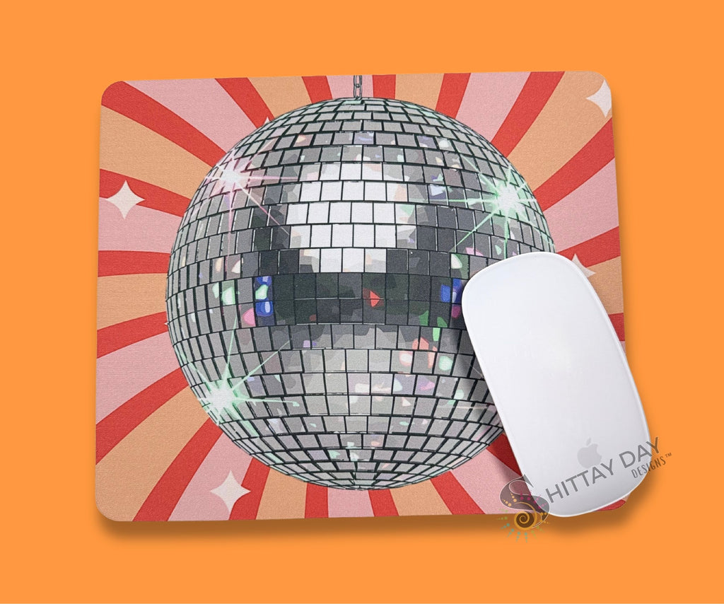 Bright disco ball mouse pad on a colorful retro starburst background for office desks and home workspaces.
