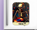 A magnet with a skeleton DJ design on a white  refrigerator background