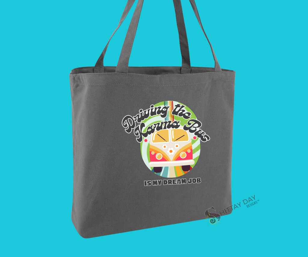 Decorative gray brown tote bag with a colorful graphic of a retro bus, colorful swirl pattern design, and text mock up, merchandised on a blue background