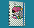 A wire bound notebook with a colorful milk carton design that says "fucktose intolerant". The background is a green checkerboard design. The image is featured on a blue background