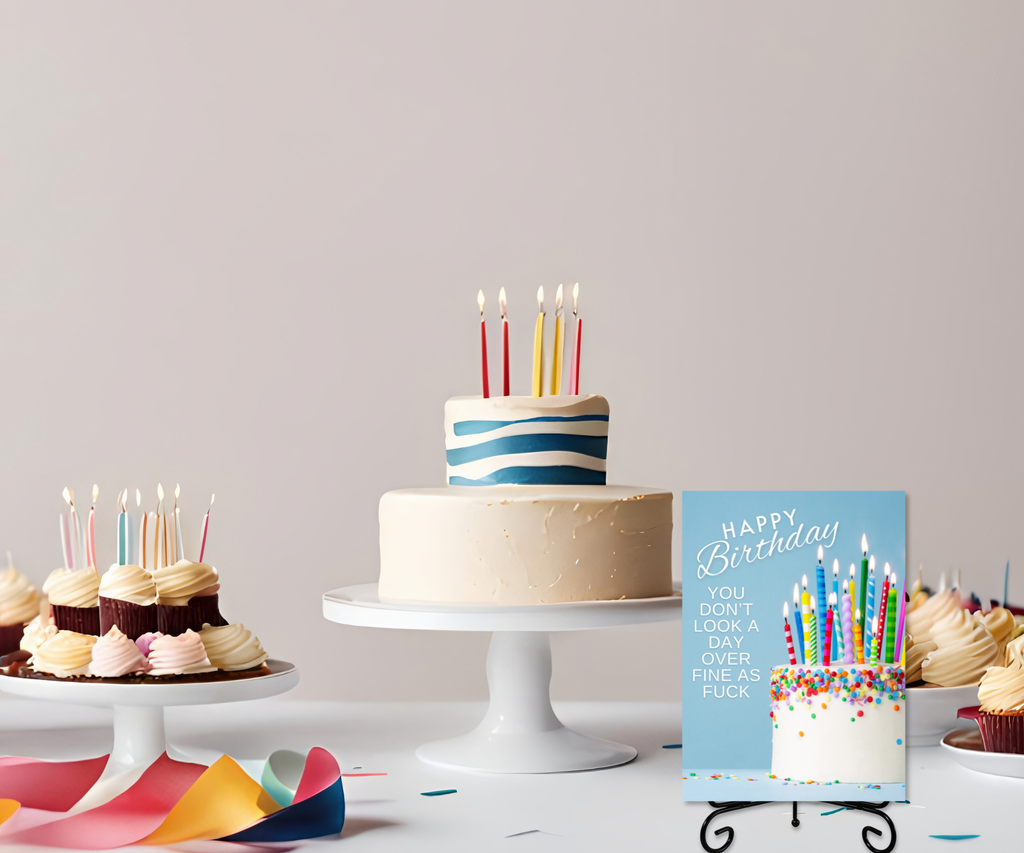 Birthday party host table with cake and goodies, featuring the aluminum keepsake greeting card on a metal stand as a table sign. The card has a birthday cake, candles and the funny text "Happy Birthday, you don't look a day over fine as fuck".