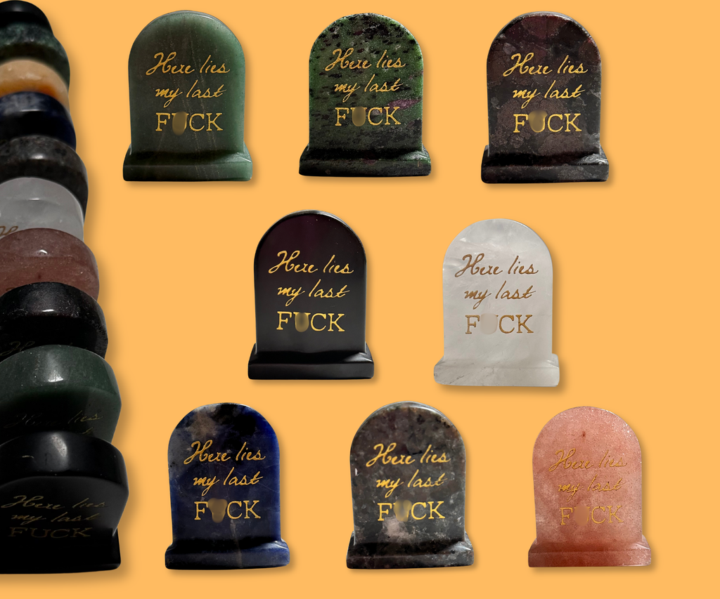 Group of natural crystal carved “Here lies my last F*CK” tombstones showing variations in crystal material and appearance.
