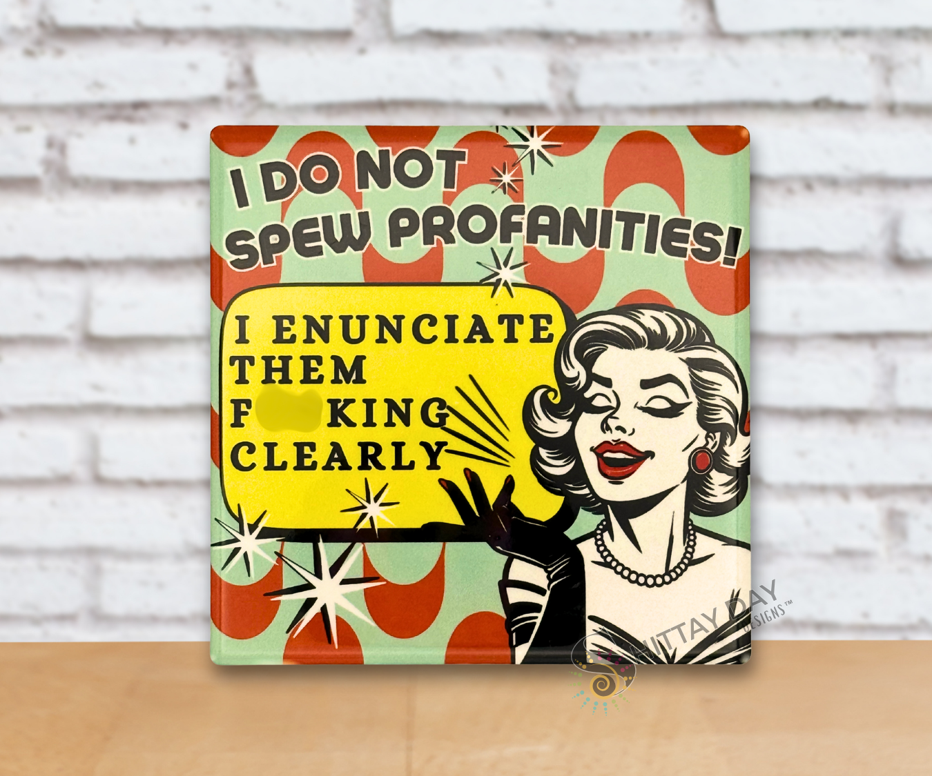 Retro design multicolor ceramic coaster with a graphic design of a woman and the sassy, humorous text 'I Do Not Spew Profanities! I Enunciate Them F*cking Clearly'.