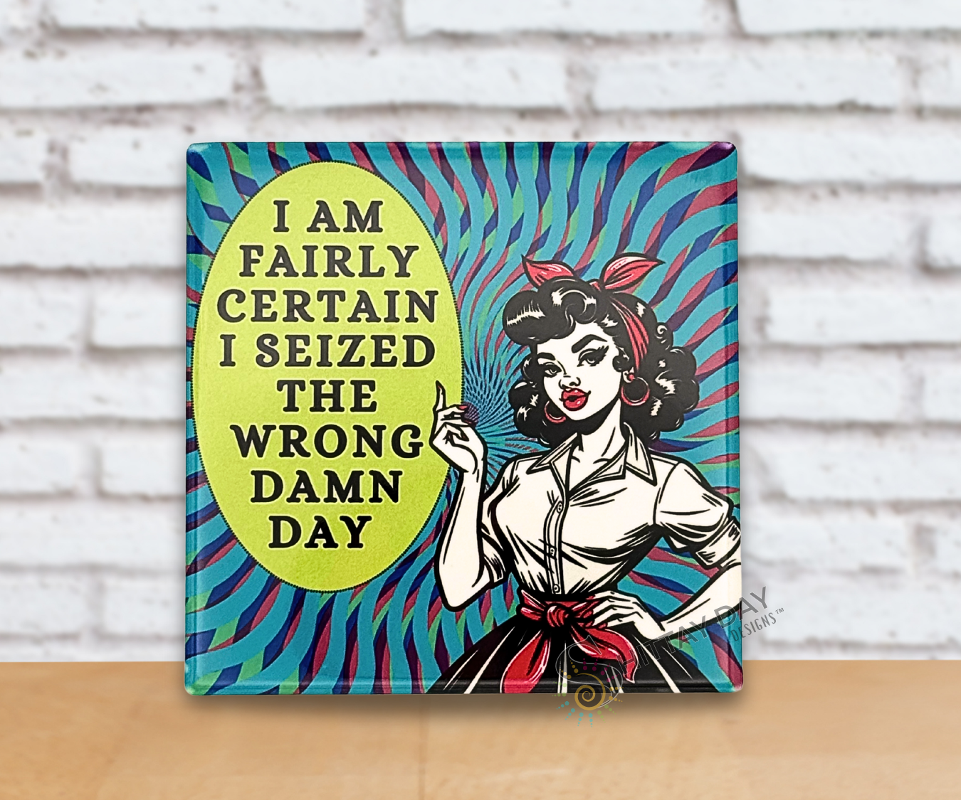Vibrant multicolored square ceramic coaster with an illustrated woman and witty text 'I Am Fairly Certain I Seized The Wrong Damn Day'.