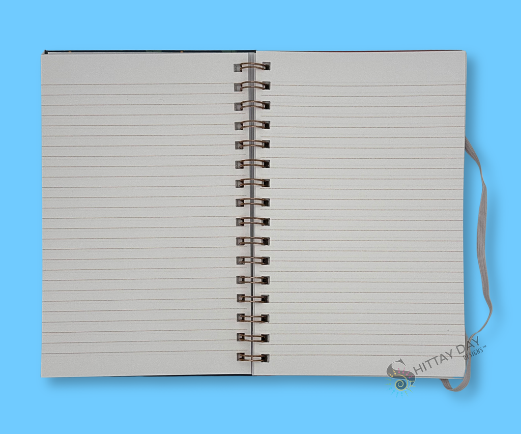 Opened wire bound notebook with gray lined pages on a blue background