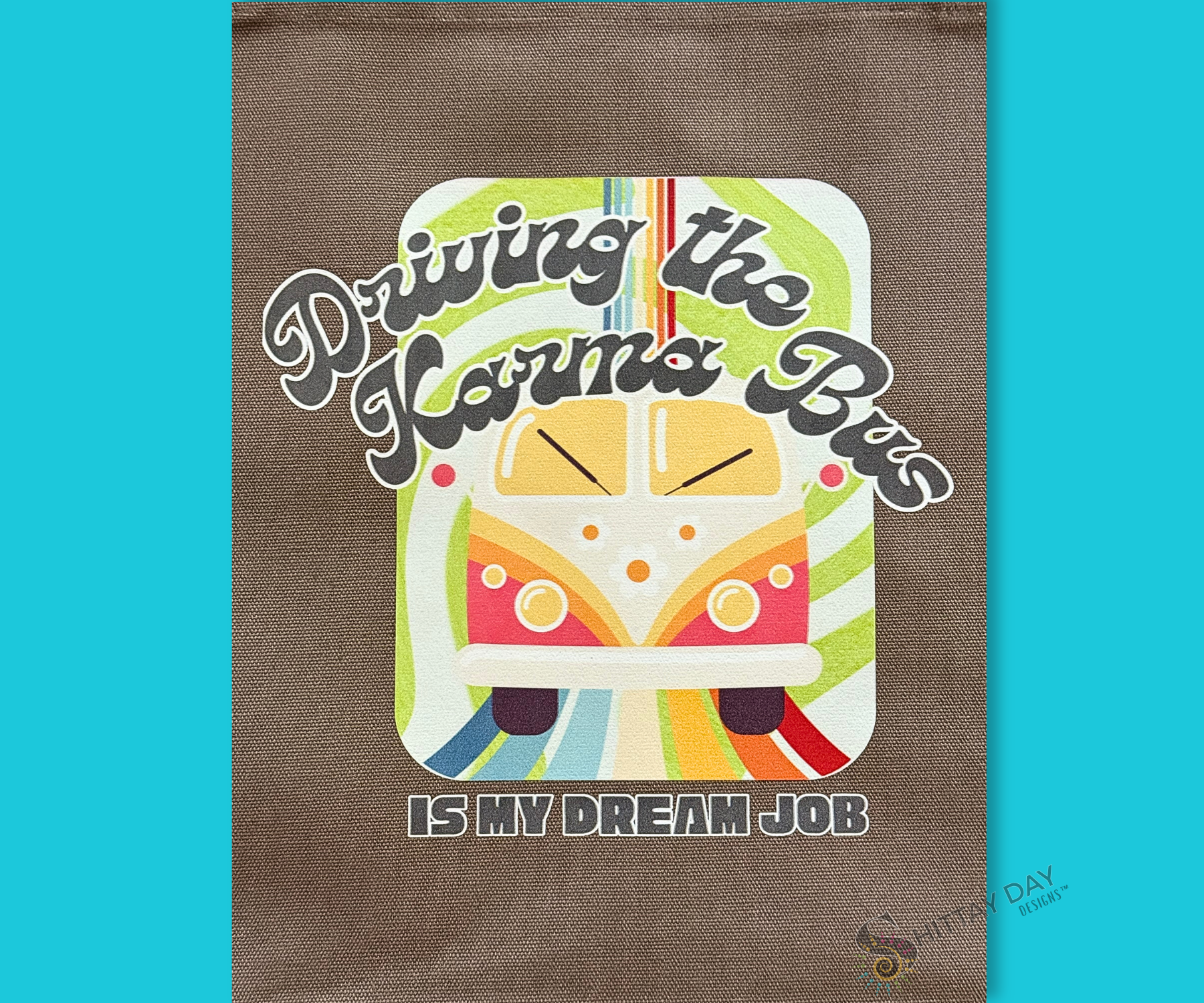 Decorative bag with a colorful graphic of a retro bus, colorful swirl pattern design, and text on a gray brown cloth background