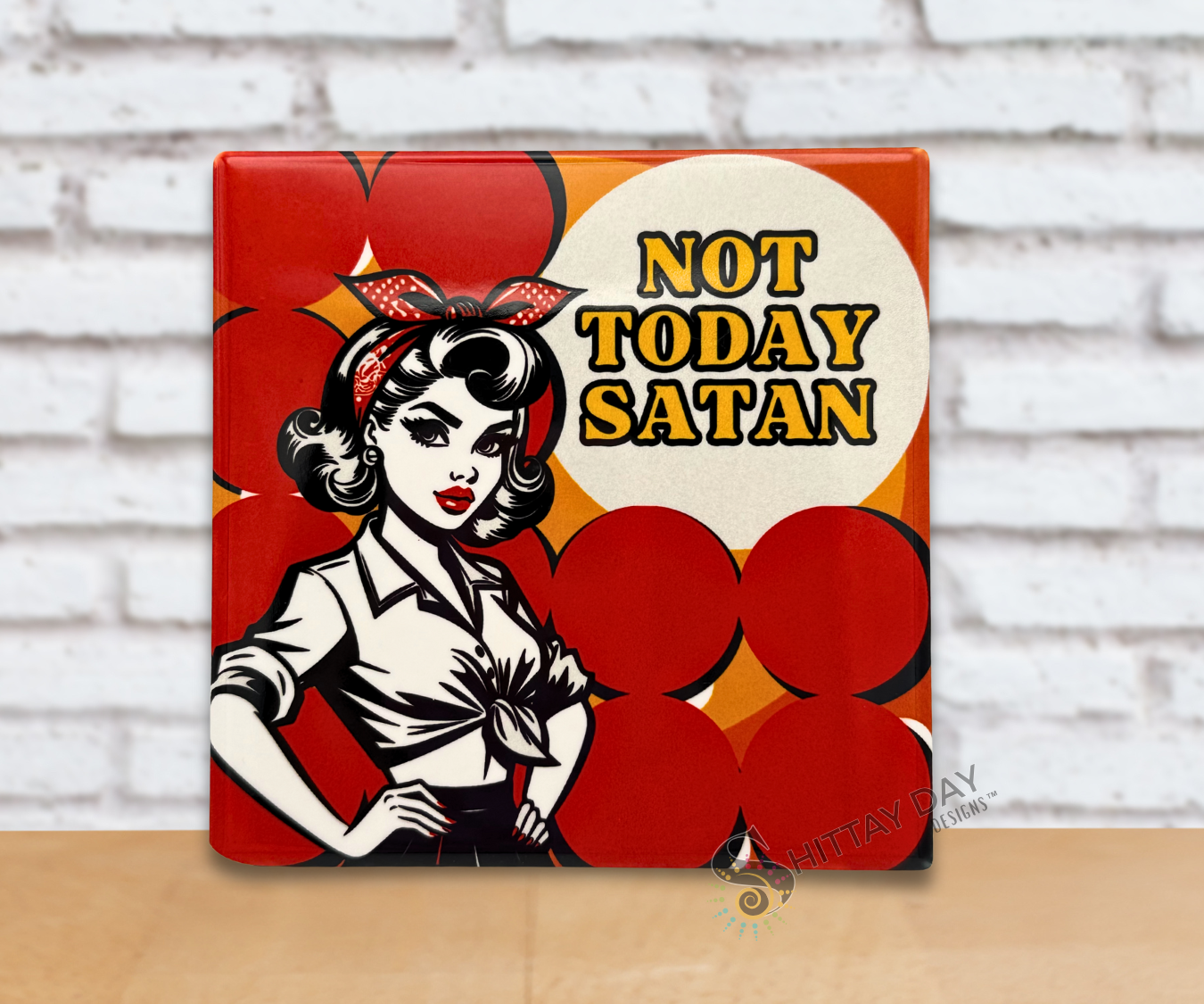 Ceramic coaster with a graphic illustration of a woman and the words 'Not Today Satan' text on a red background.