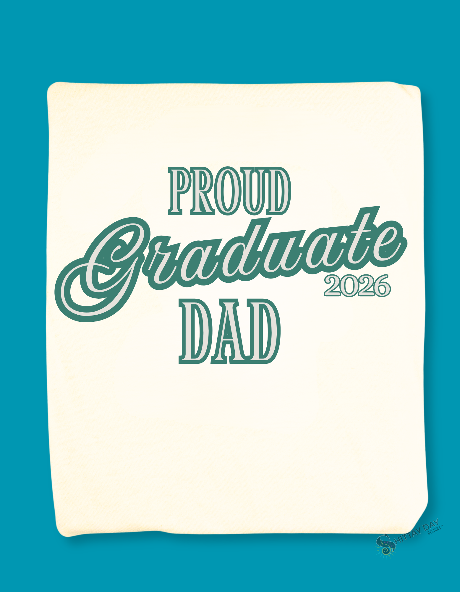 Natural color folded tshirt with a close up of the design; 'Proud Graduate Dad 2026'  teal text. Merchandised on a blue background.