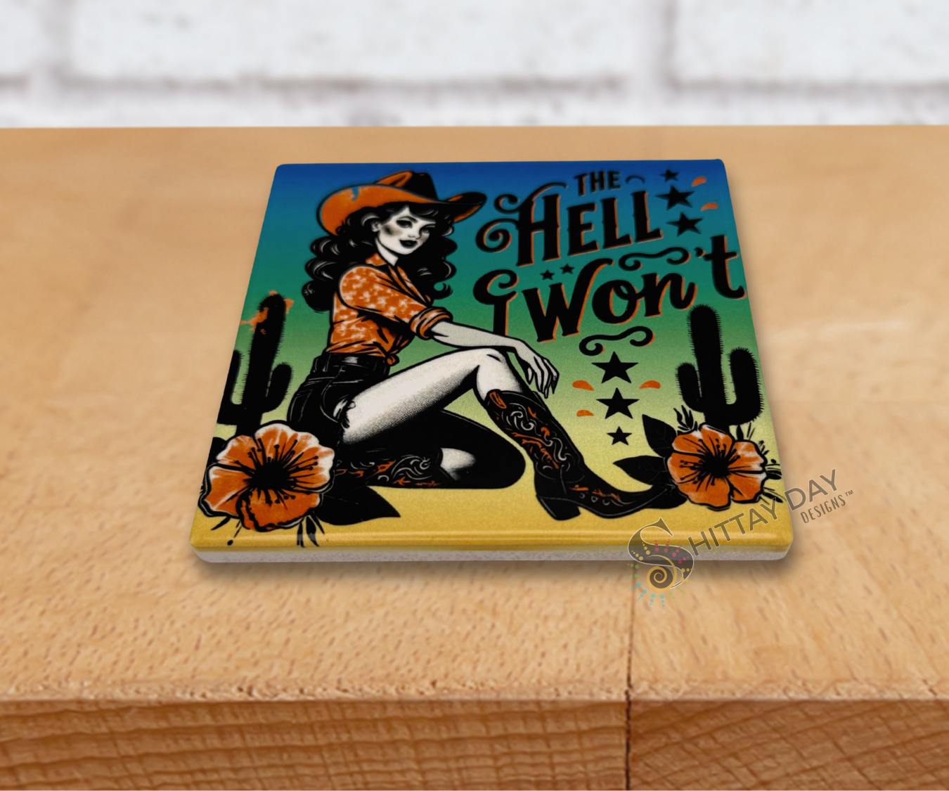 Retro vibe cowgirl on a ceramic coaster and a sassy text reading 'The Hell I Won't' in stylized font, on a gradient colored background with cacti and flowers.