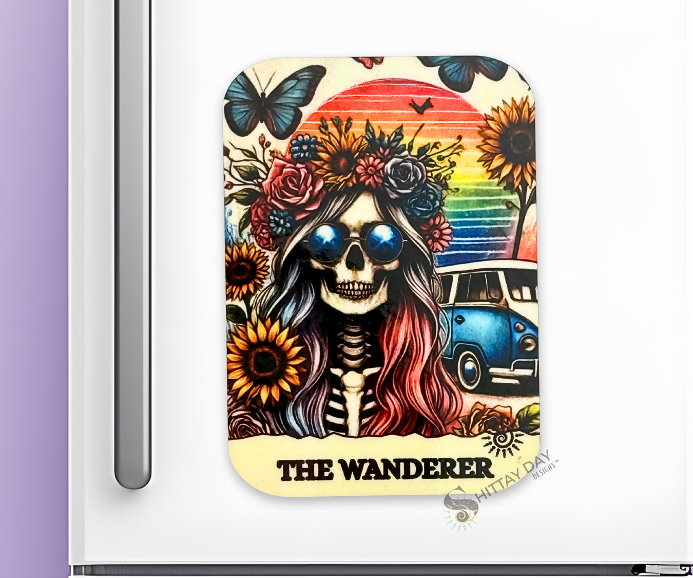 Colorful Bone-afide Personality Magnet with a skeleton, flowers, microbus, and rainbow sunset design on a white background with the text "The Wanderer"